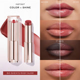Lancome Lip Idole Butterglow lipstick balm in a rosy nude shade, with a clear faceted cap and metallic casing.