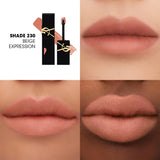 Black YSL liquid lipstick tube with gold-toned logo, open to show a doe-foot applicator with peachy-beige matte liquid, Shade