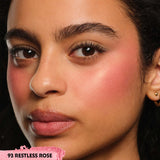 A swatch of YSL Powder Blush in Shade 93 Restless Rose, a finely milled medium rose pink powder.