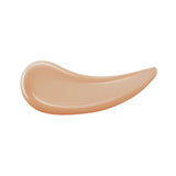 A curved swatch of light beige foundation with a smooth, slightly glossy finish.