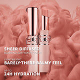 Two lip balms, one capped, one open revealing a light nude balm. Both have a light pink base and rose-gold-toned YSL logo ban