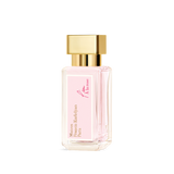 Clear glass perfume bottle with pink liquid, a pink label, and a gold-toned rectangular cap and collar.