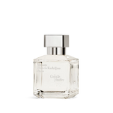 Clear rectangular glass perfume bottle with faceted edges and a silver-toned rectangular cap.