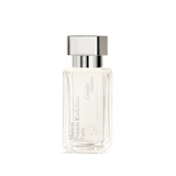 Clear rectangular perfume bottle with faceted edges, light liquid, silver-toned cap. 'Maison Francis Kurkdjian Paris Gentle f