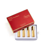 Red and gold Maison Francis Kurkdjian Baccarat Rouge 540 roll-on elixir set with four 4ml bottles of amber liquid.
