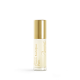 Small clear glass roll-on bottle with pale yellow liquid, gold-toned cap, and gold-toned text 'Maison Francis Kurkdjian Paris