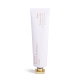White cylindrical hand cream tube with gold-toned lettering and a square gold-toned cap.