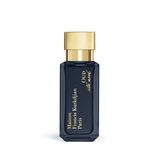 Dark blue rectangular perfume bottle with faceted base and a shiny gold-toned cap, featuring gold lettering.