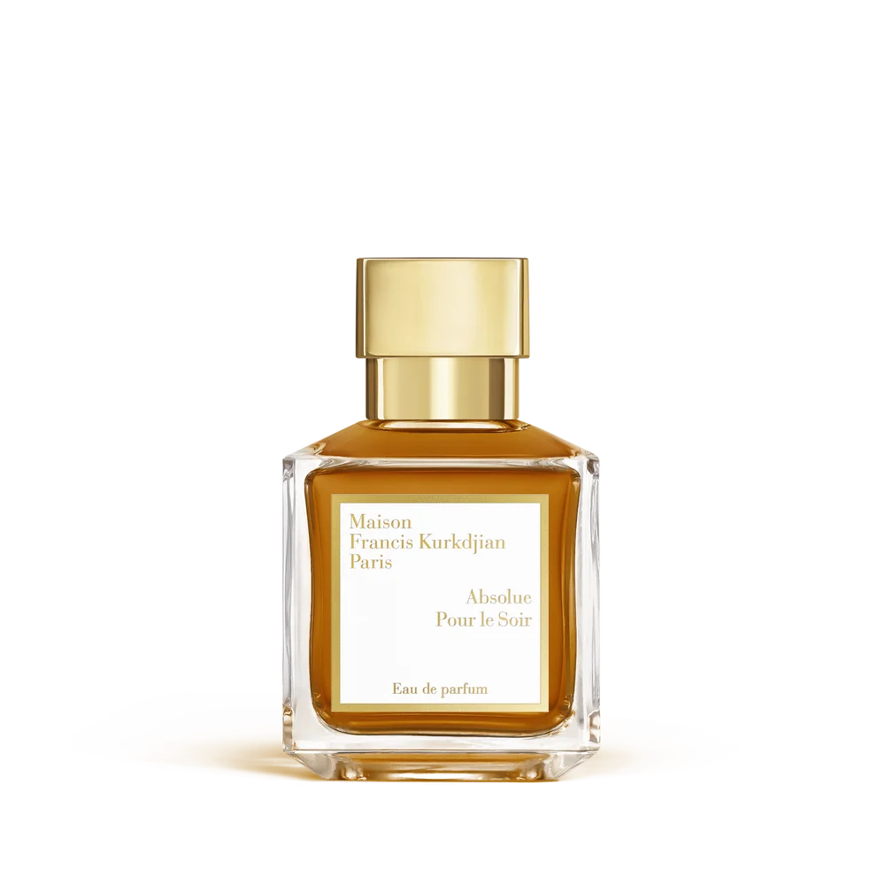 Rectangular clear glass perfume bottle with amber liquid and a shiny gold-toned cap, featuring a white label.