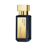 Dark blue faceted perfume bottle with a gold-toned cap. A gold-toned label reads 'Maison Francis Kurkdjian Paris OUD velvet m