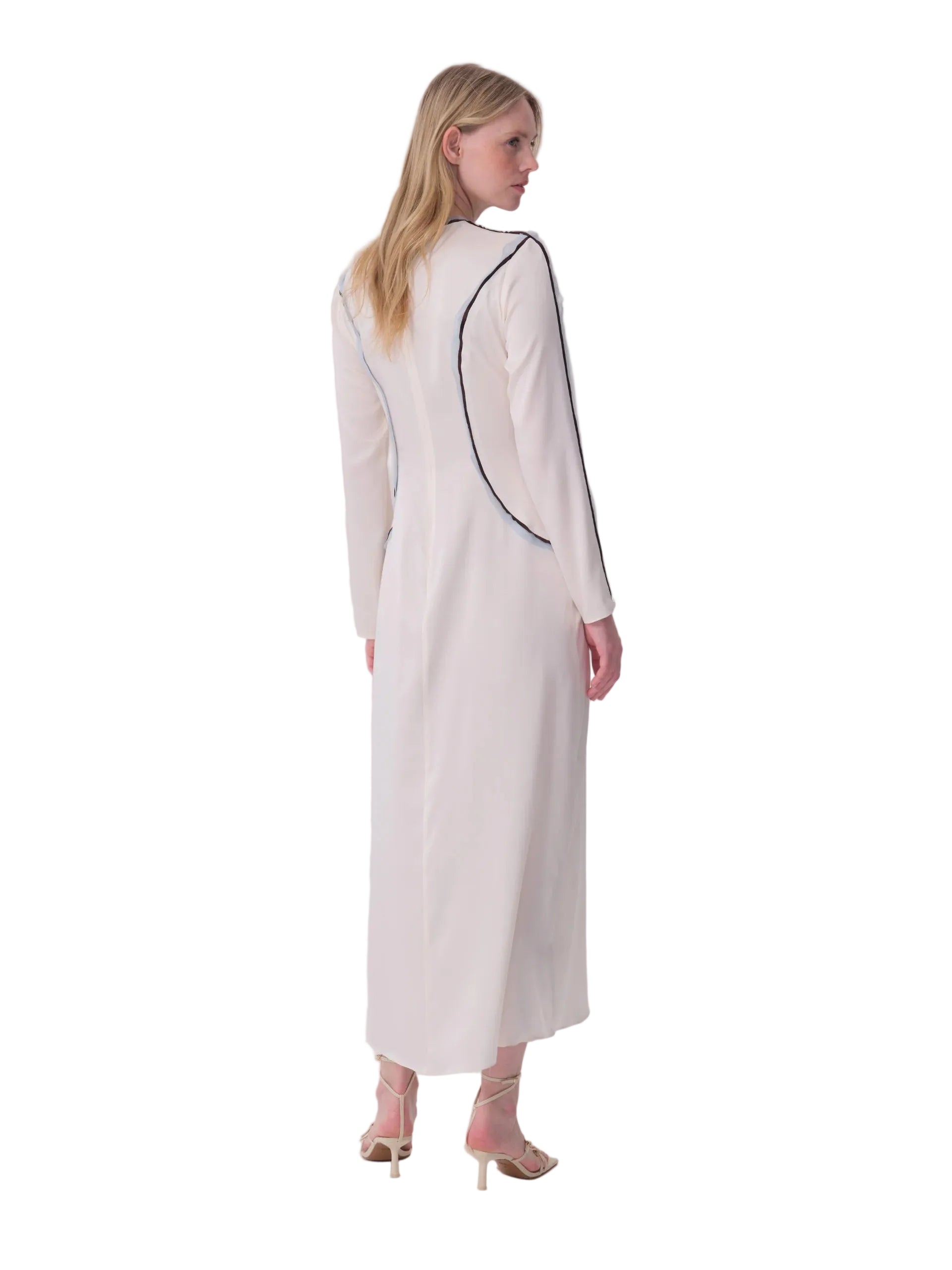 Ecru midi dress with long sleeves and black piping outlining curved seams on the back and sleeves.