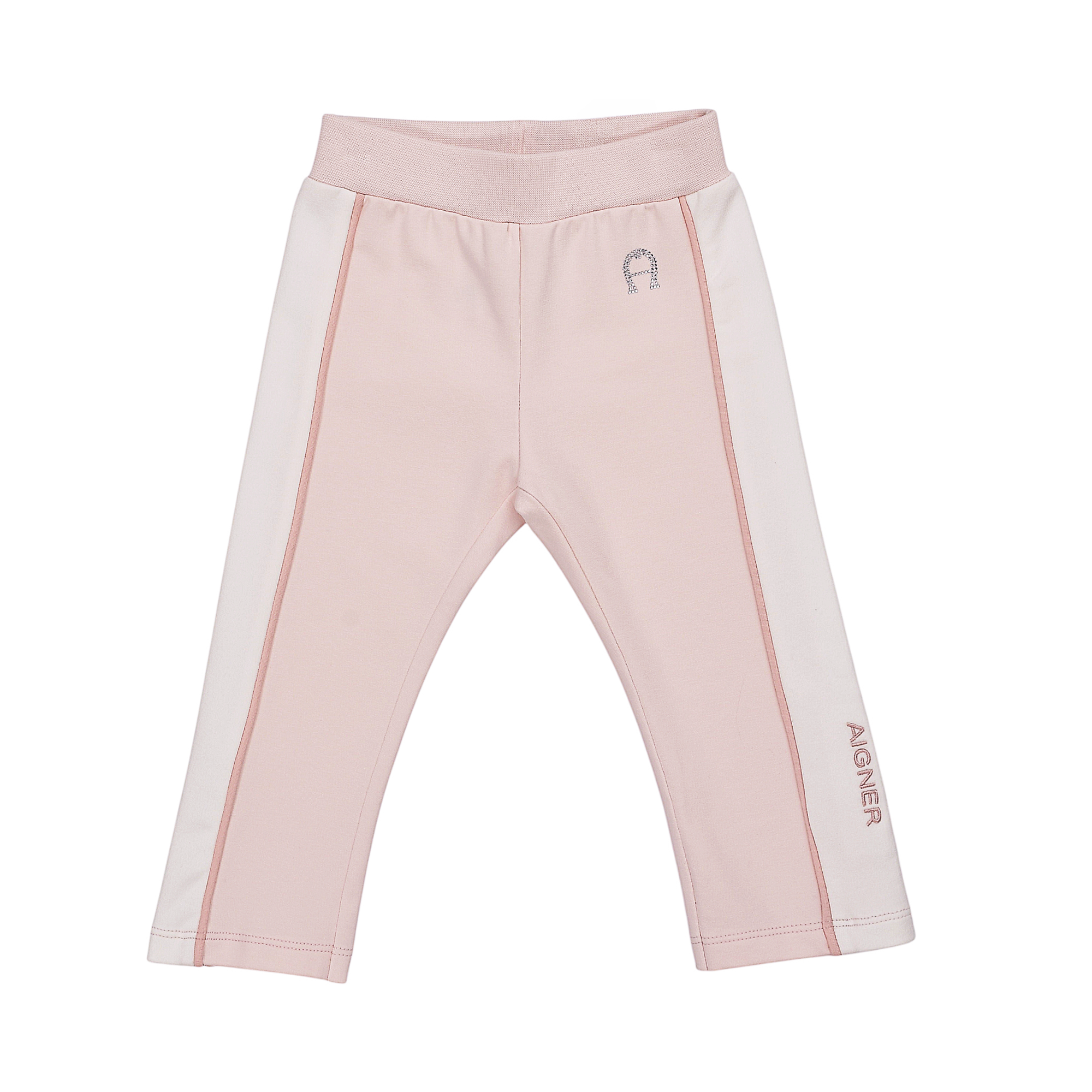 Light pink jogging suit pants with white side stripes, pink piping, a ribbed waistband, a studded 'A' logo, and 'AIGNER' text