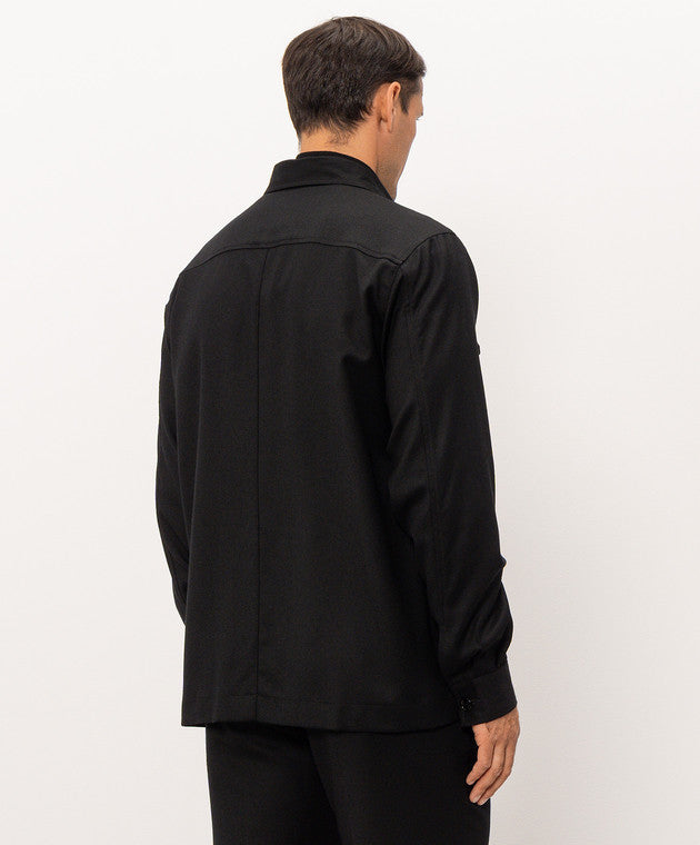 Black sport jacket with a collar, back yoke seam, long sleeves, and buttoned cuffs.
