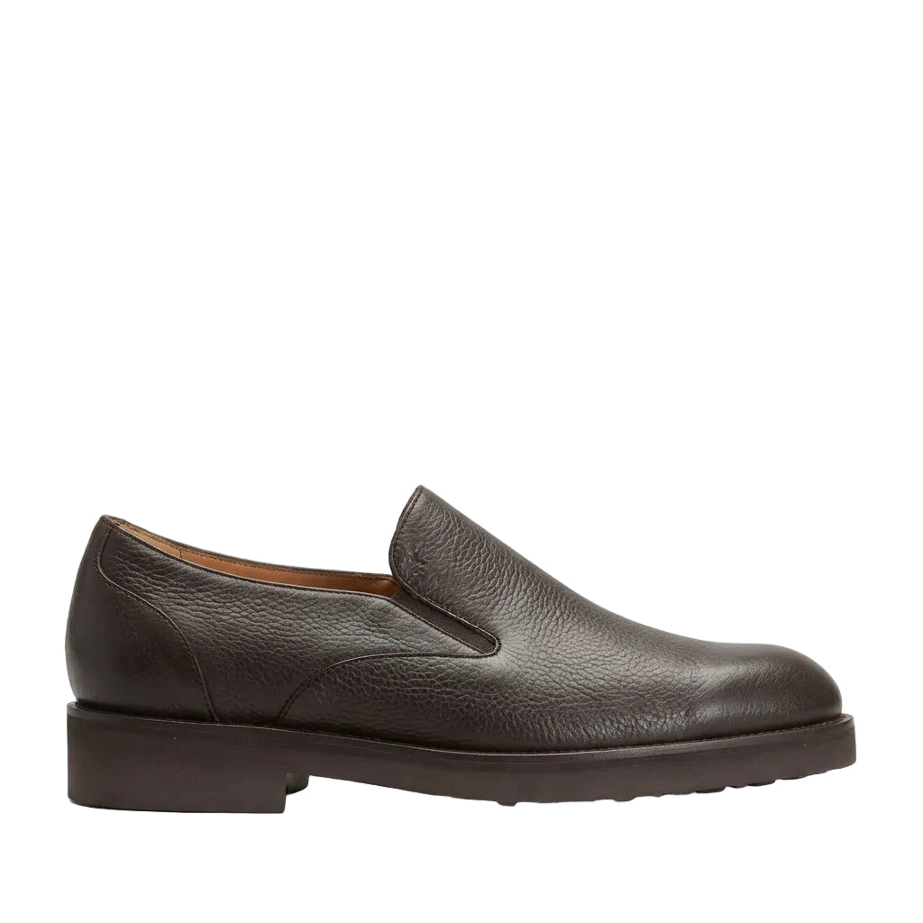 Dark brown pebbled leather men's slip-on shoe with a rounded toe and low block heel, viewed from the side.