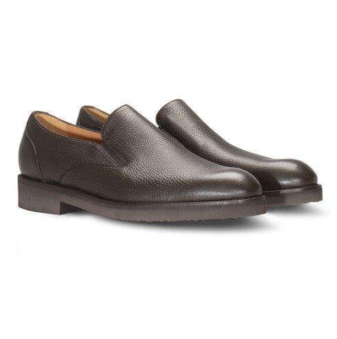 Pair of dark brown pebbled leather slip-on loafers with a plain toe, low block heel, and lighter brown interior lining.