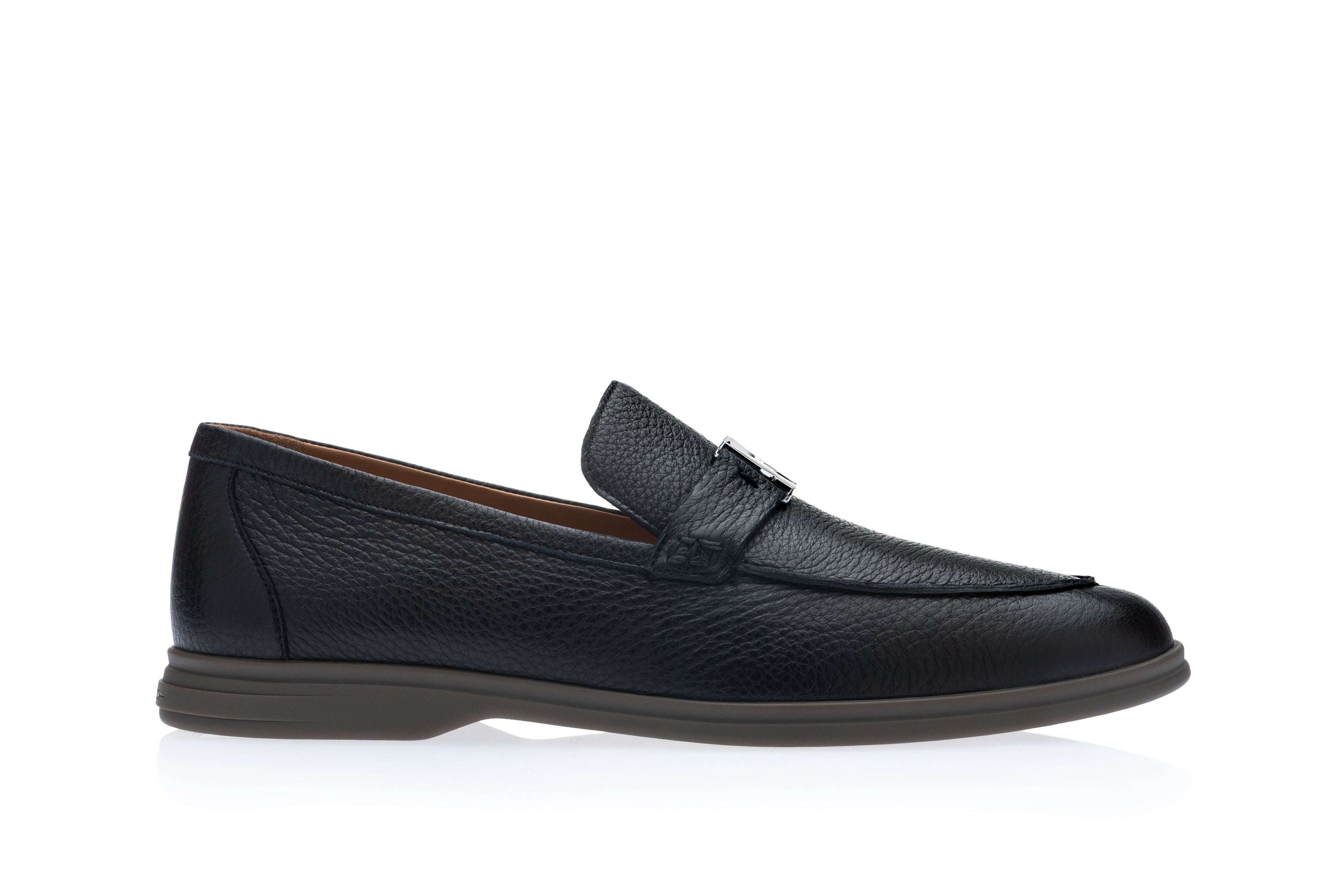 Men's navy blue pebbled leather loafer shoe with moc-toe stitching and a silver-toned metal buckle on the vamp strap.