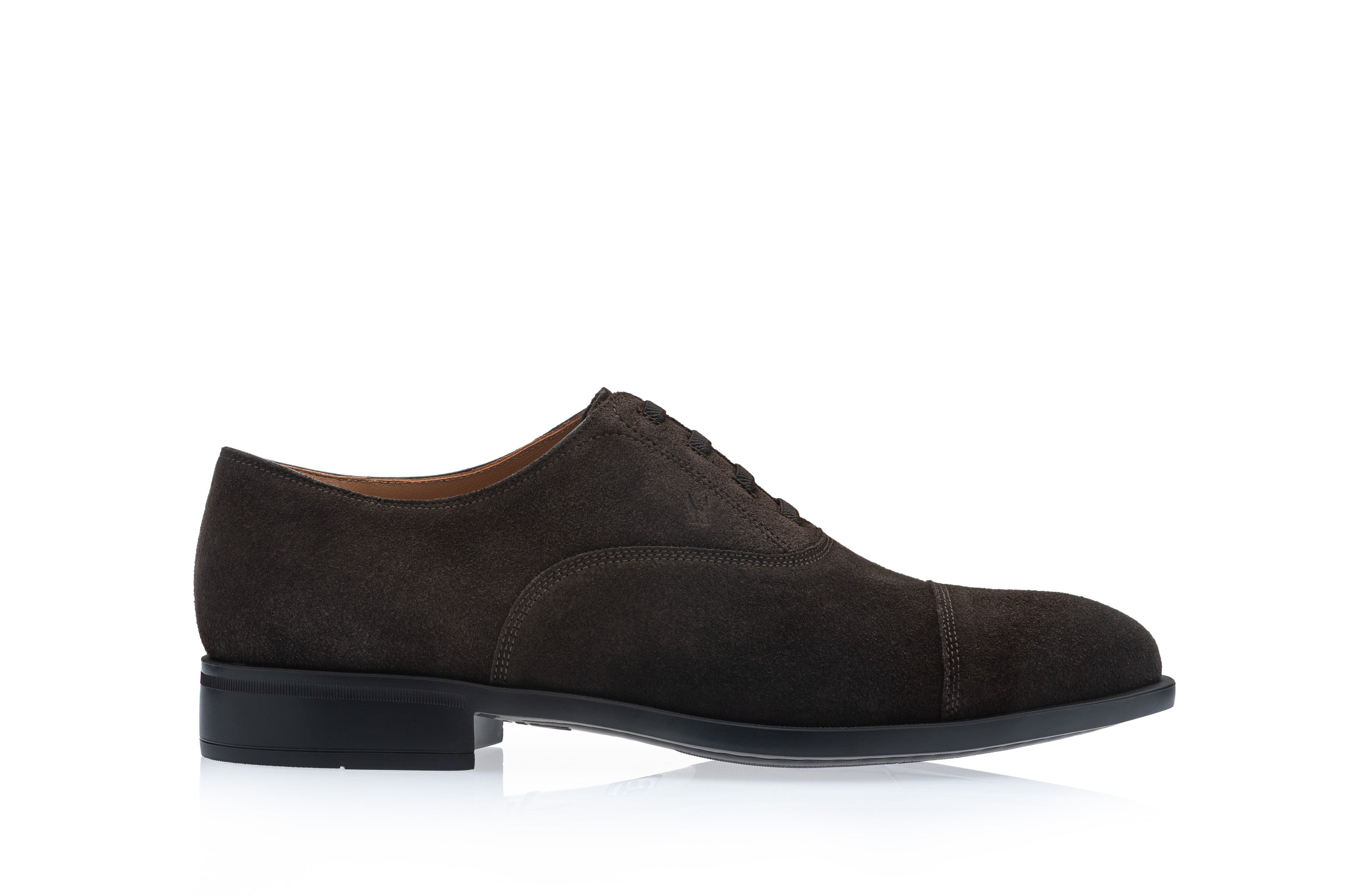 Dark brown suede men's Oxford shoe with a cap toe and closed lacing system, viewed from the side.