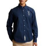 Navy blue long-sleeved shirt with white buttons and a white embroidered 'England polo player est. 1987' logo on the left ches