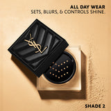 Partially open YSL powder in a clear square container with a black quilted lid and gold-toned YSL logo. Light beige powder vi