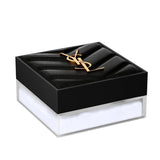 Black quilted YSL Hyper Blur Powder compact with a gold-toned logo on the lid and a clear base showing white powder.