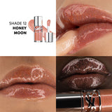 Peachy-orange glitter lip gloss in a clear tube with a silver-toned cap and YSL logo band. Doe-foot applicator.