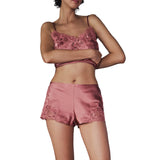 Rose pink satin camisole with floral lace trim and matching short shorts with lace appliqué on the sides.