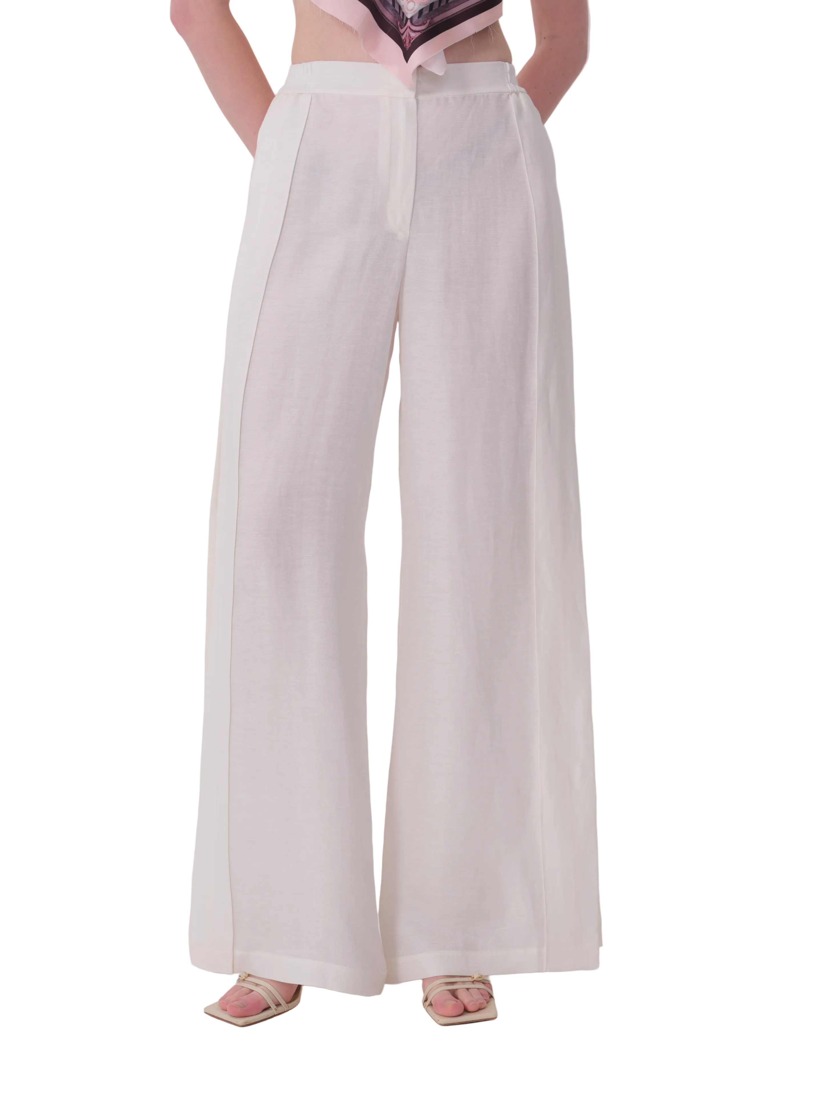 Ecru high-waisted wide-leg trousers with a front zip fly and vertical seam details down each leg.