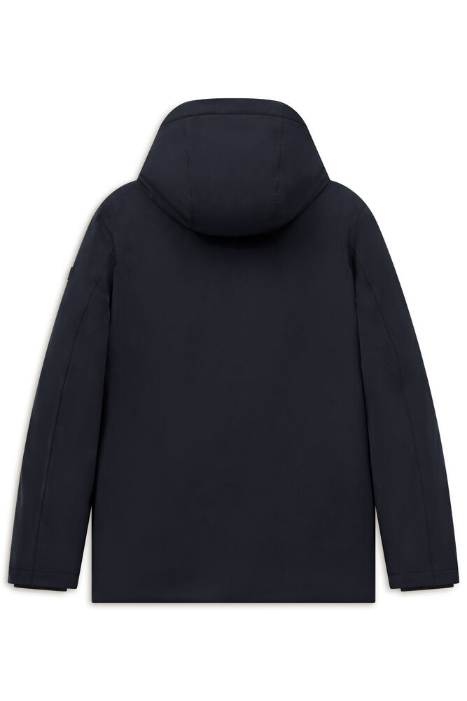 Dark blue hooded jacket, back view. Smooth fabric with long sleeves and a subtle rectangular patch on the upper left sleeve.