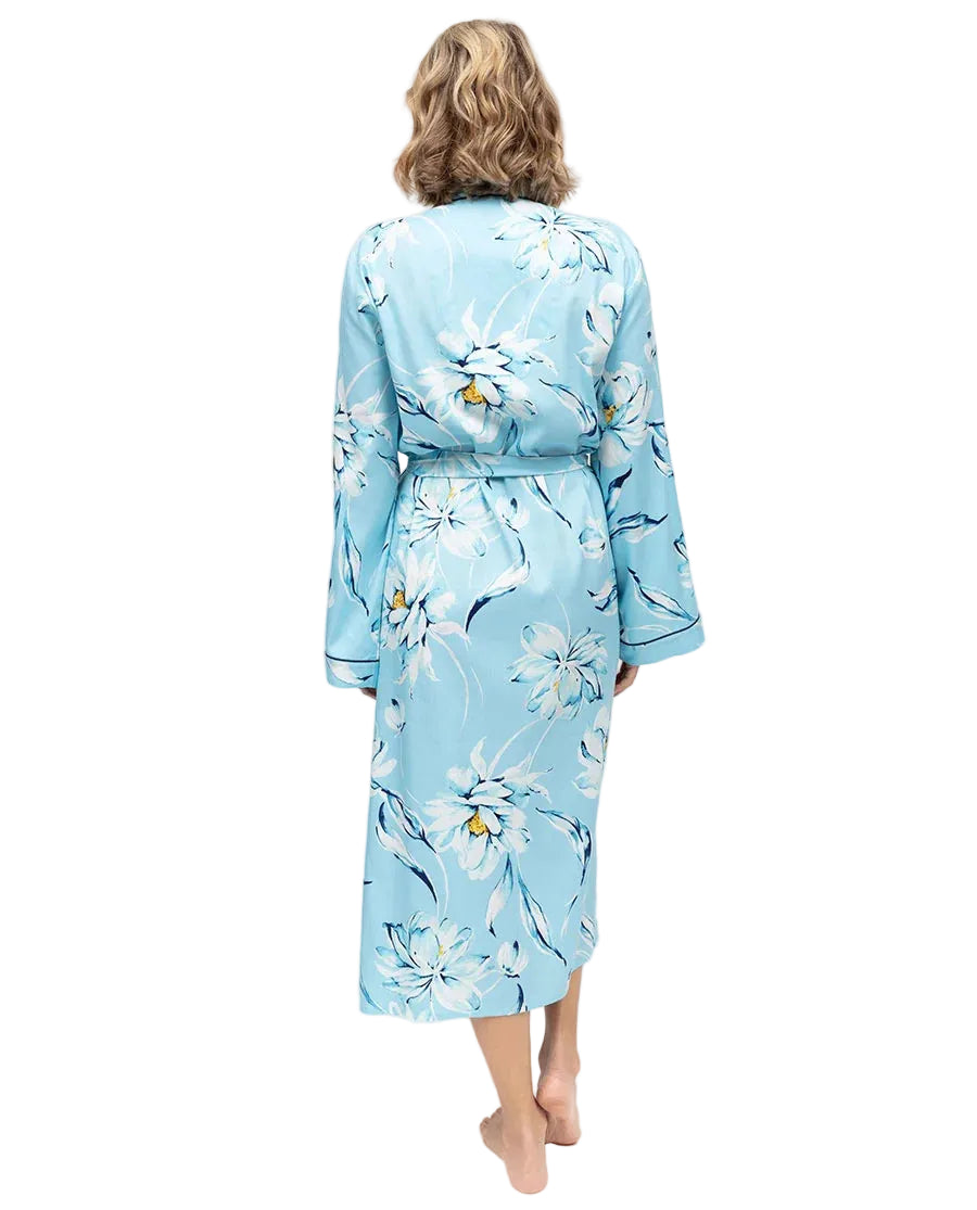 Midi-length light blue woven dressing gown with white and blue floral pattern, long sleeves, tie belt, and dark blue trim on