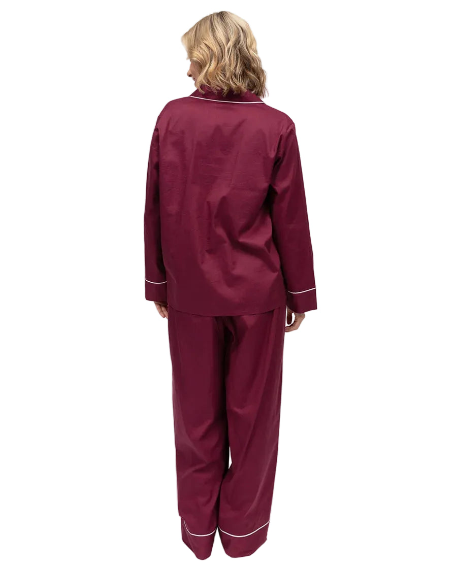 Ox blood long-sleeved pajama set with white piping on the collar, sleeve cuffs, and pant hems.