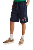 Navy blue jersey shorts with an elastic drawstring waist, silver-toned tips, side pockets, and a red embroidered polo logo on