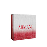 Rectangular gift box with shimmery silver-white top fading to red bottom. Red 'ARMANI' on front, white 'ARMANI' on red side.