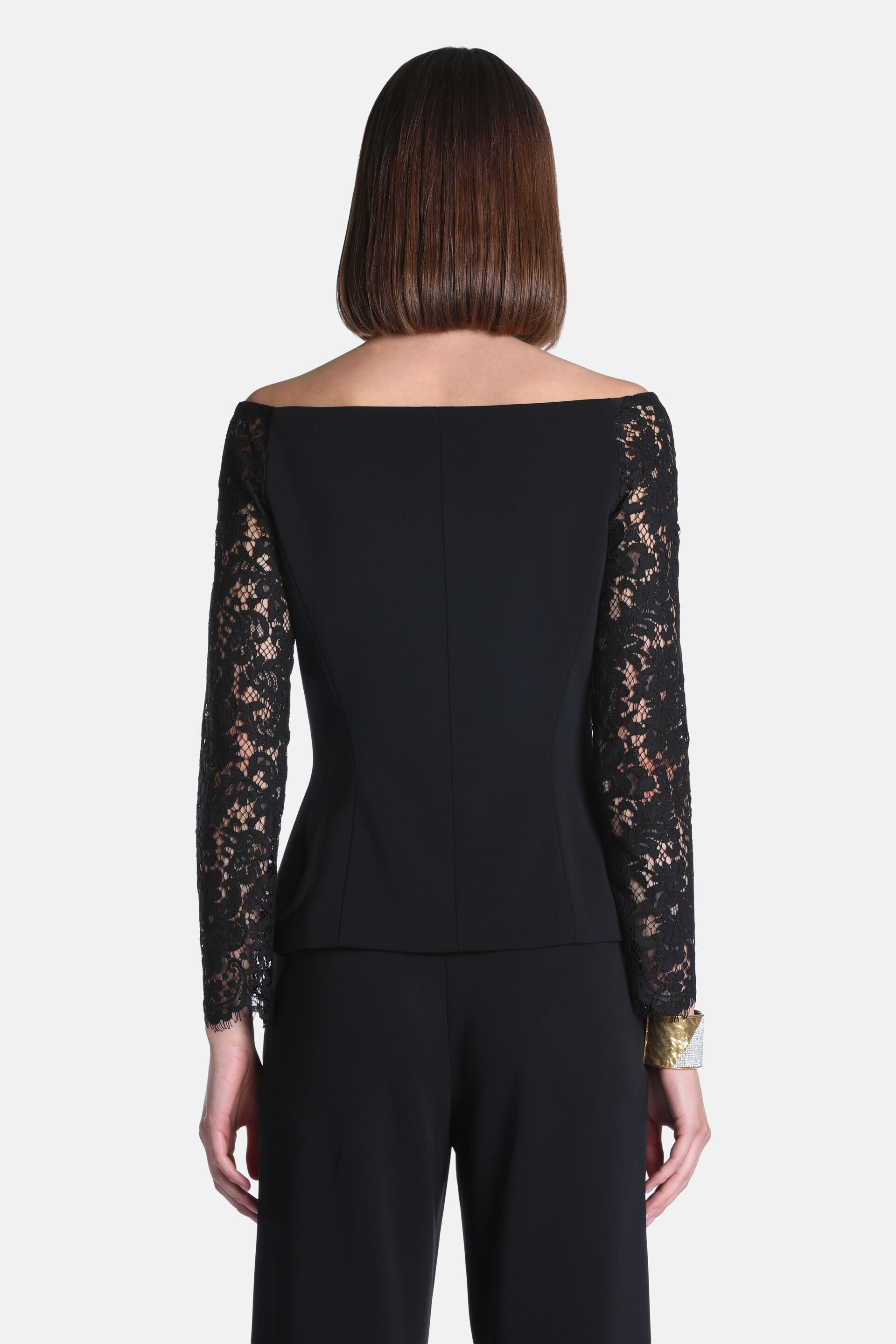 Black off-the-shoulder jacket with a smooth back and long, intricate black lace sleeves.