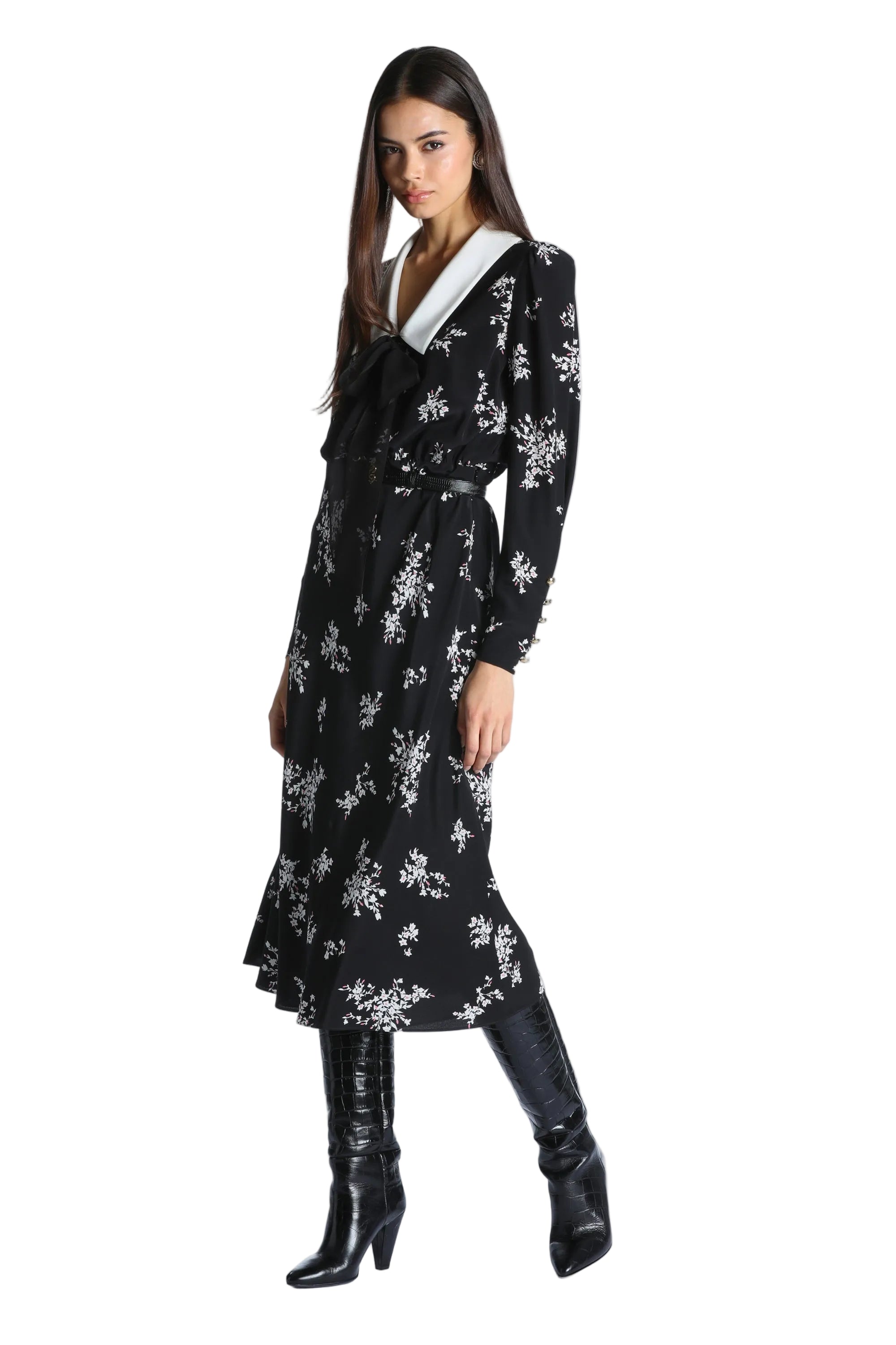 Black midi dress with white floral print, a white pointed collar, a black self-tie bow, and long sleeves with buttoned cuffs.