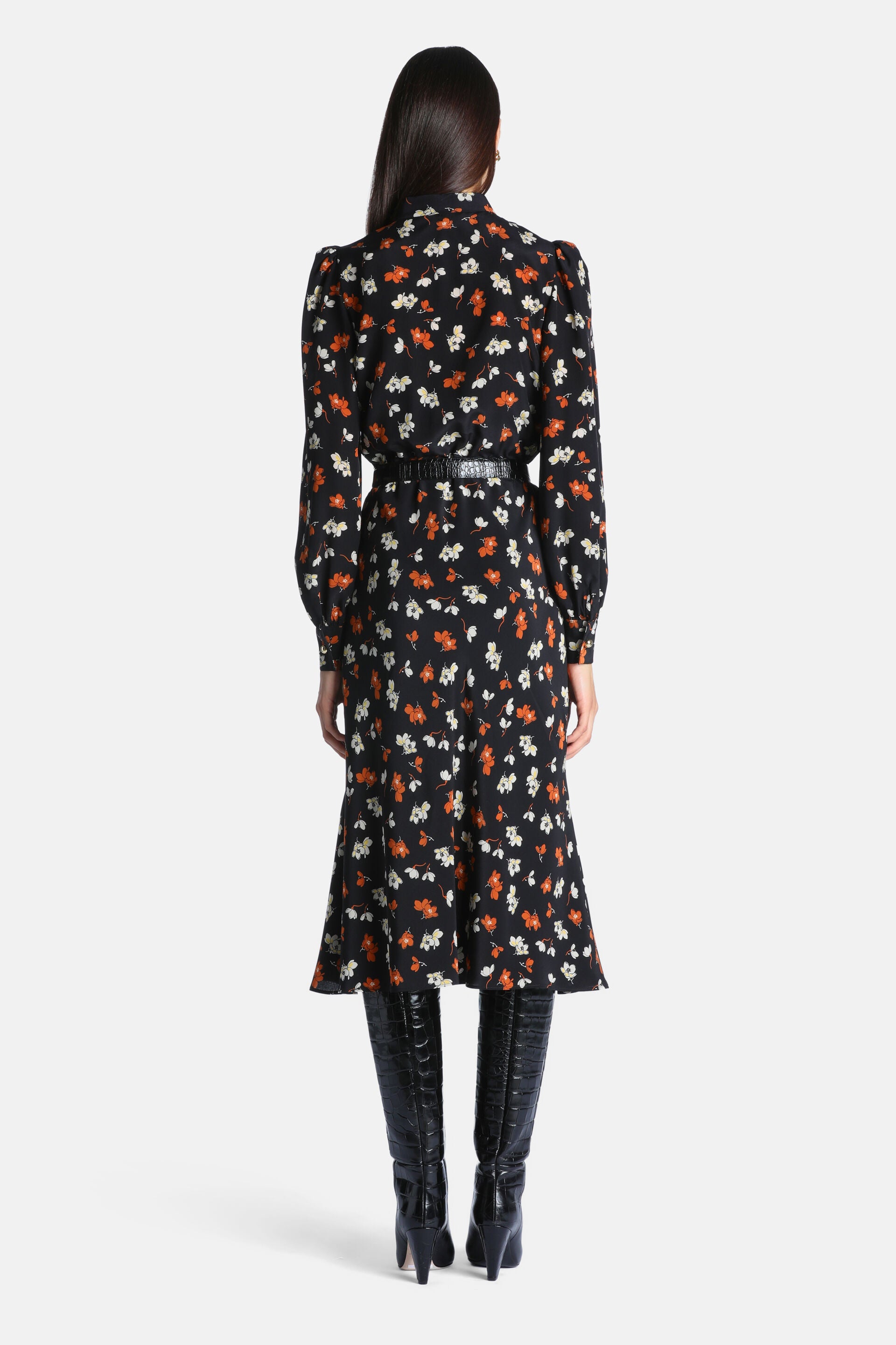 Black midi dress with orange and white floral print, puffed long sleeves, stand-up collar, and a black crocodile-embossed bel