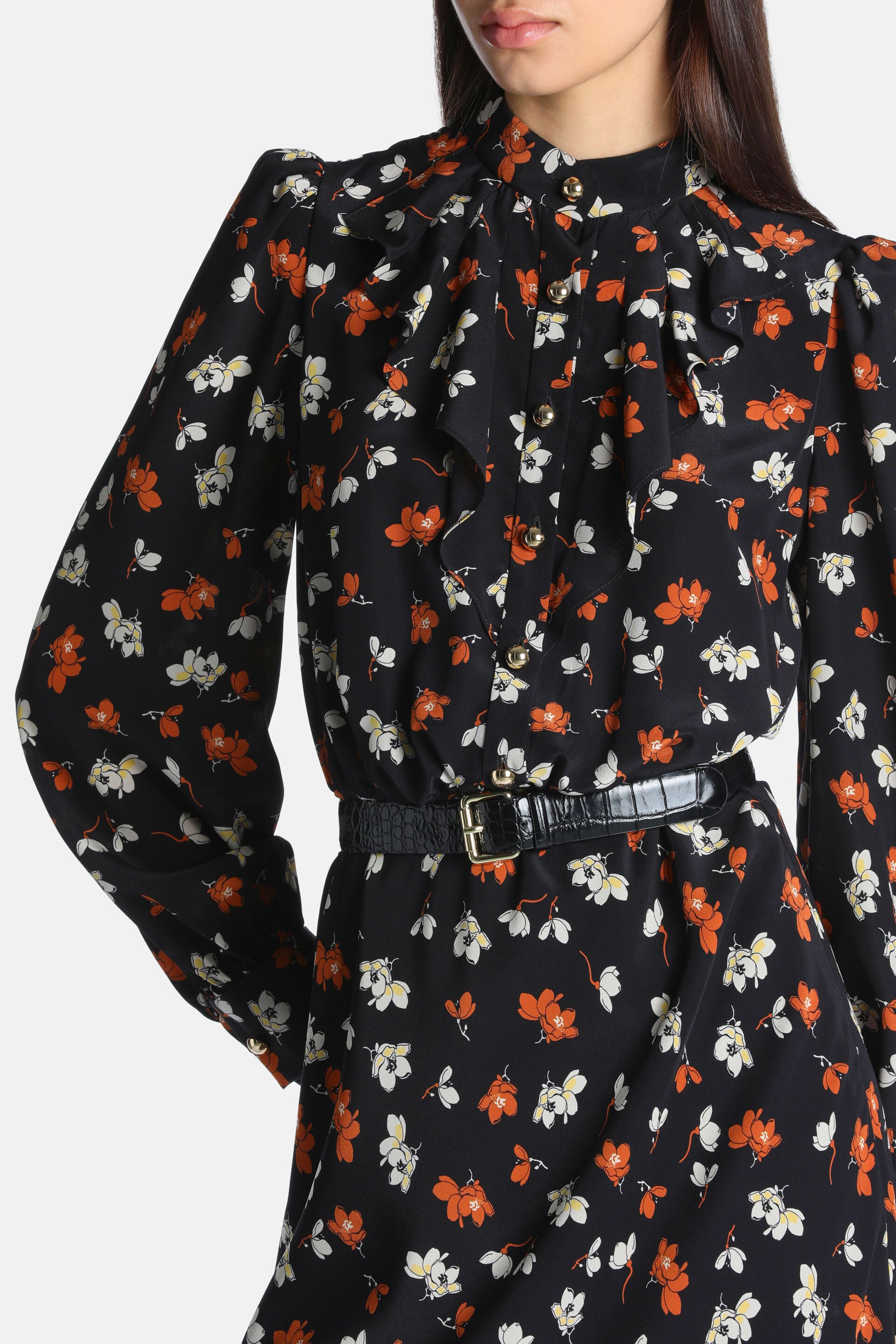 Black floral dress with ruffled high neck, gold-toned buttons, long sleeves, and a black croc-embossed belt.