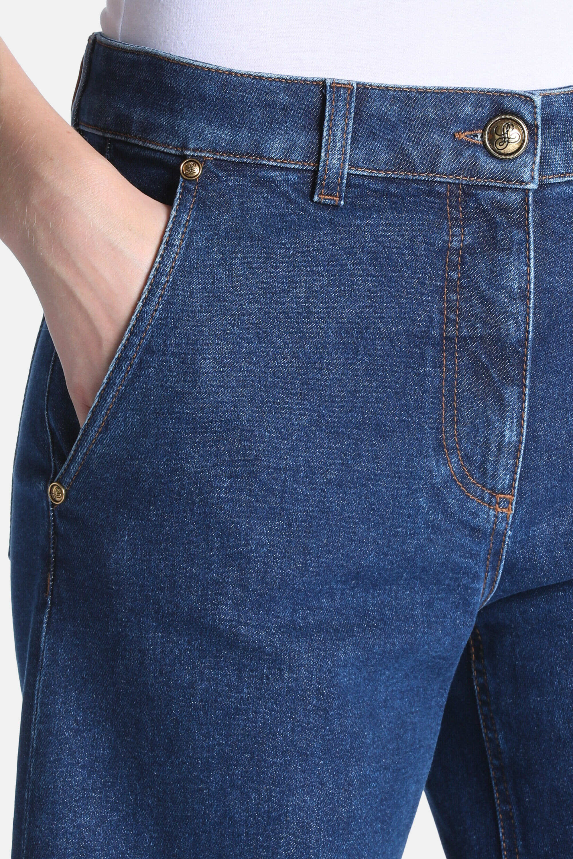 Dark blue denim trousers with orange contrast stitching, a gold-toned button, and gold-toned rivets on the front pocket.