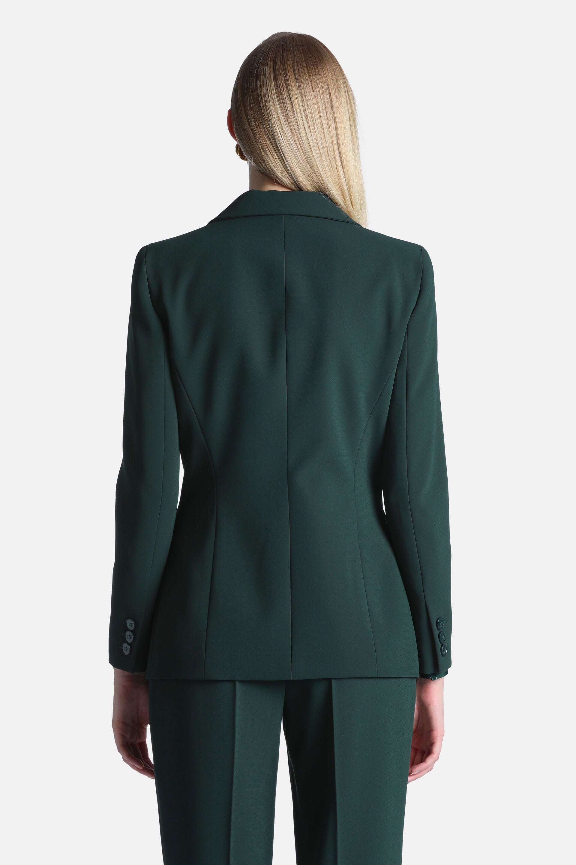 Dark green tailored blazer with a notched lapel, tailored back seams, and three dark buttons on each cuff.