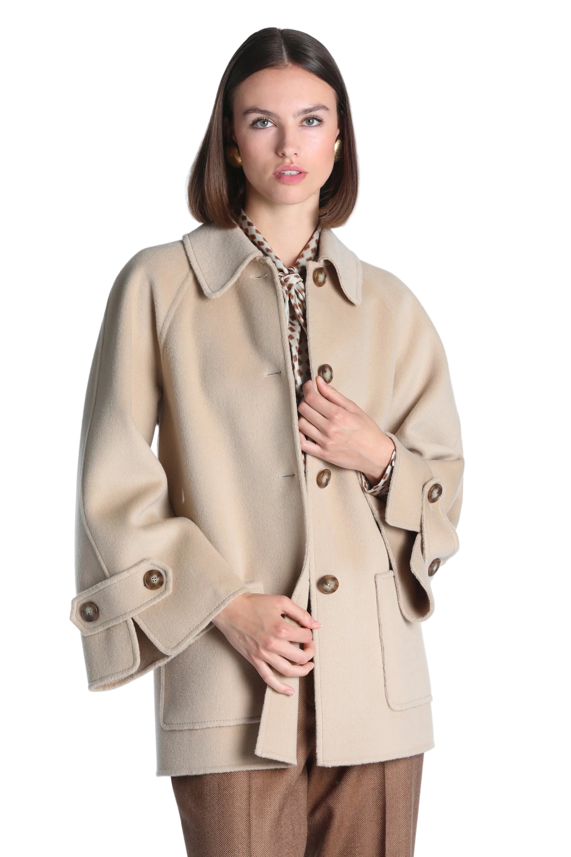 Light beige short coat with a classic collar, button-front closure, raglan sleeves, and front patch pockets.