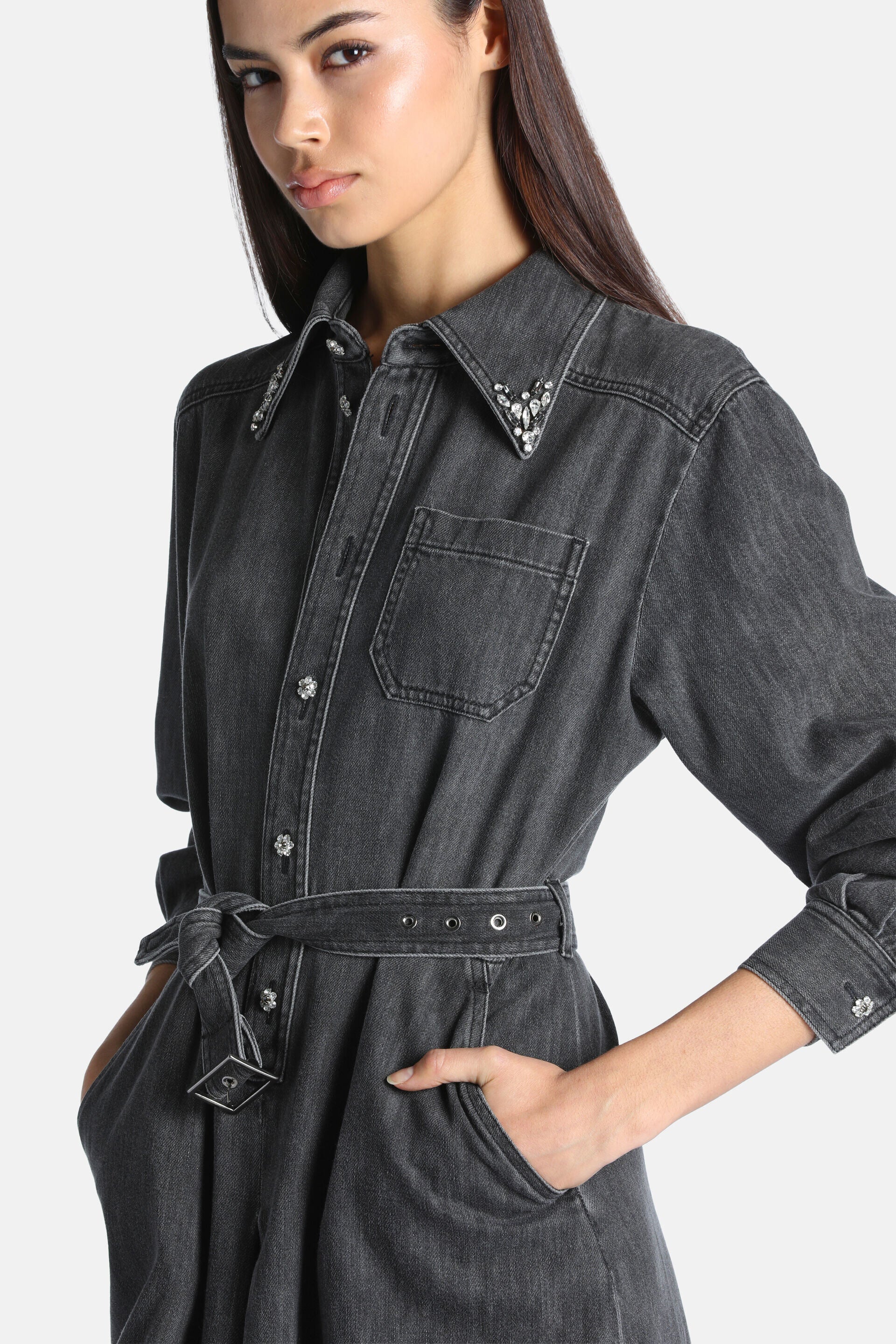 Grey washed denim dress with rhinestone collar, clear buttons, chest pocket, and a tied denim belt with silver-toned eyelets.