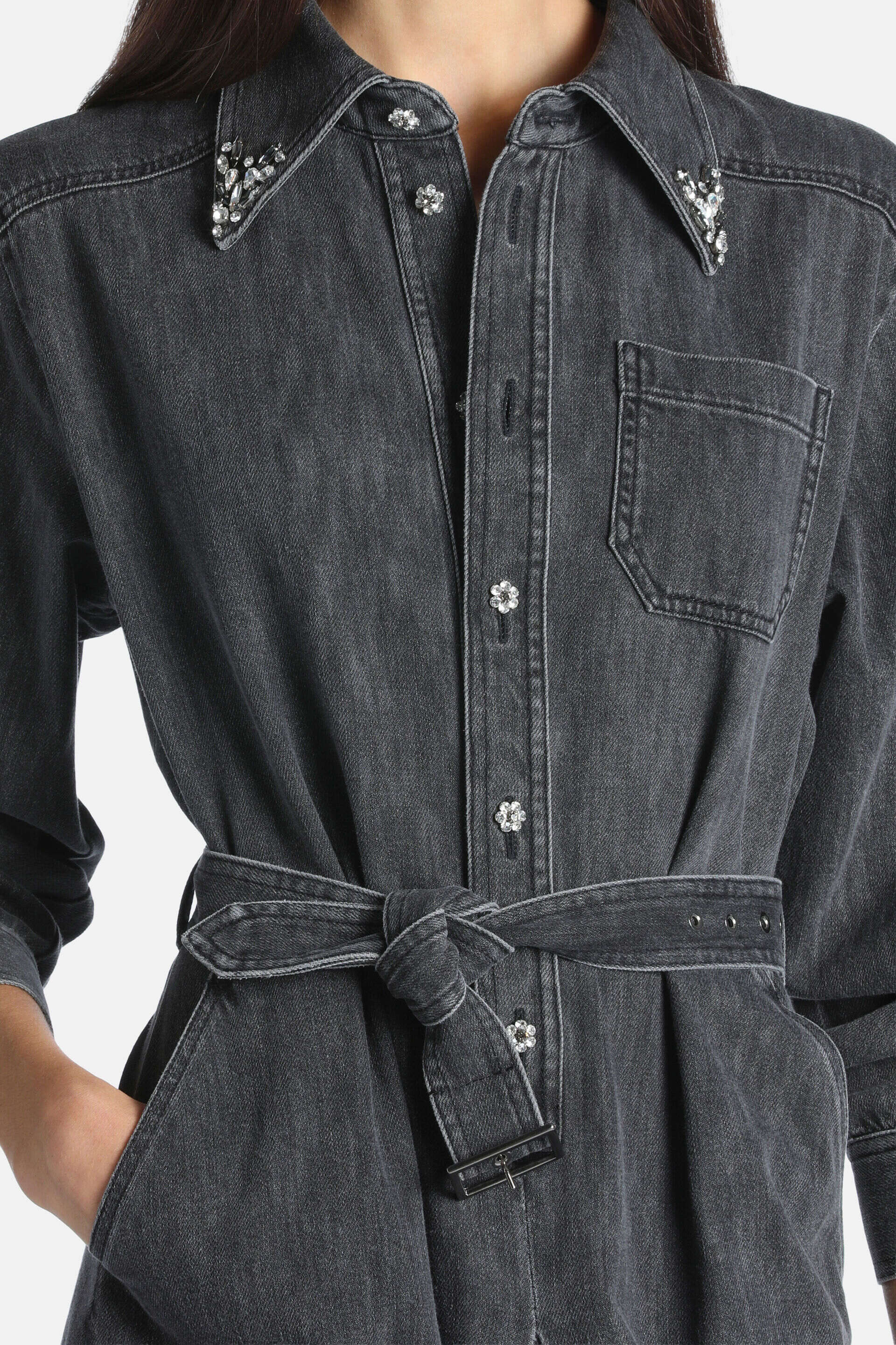 Grey denim shirt dress with rhinestone-embellished collar, flower crystal buttons, chest pocket, and tied denim belt.