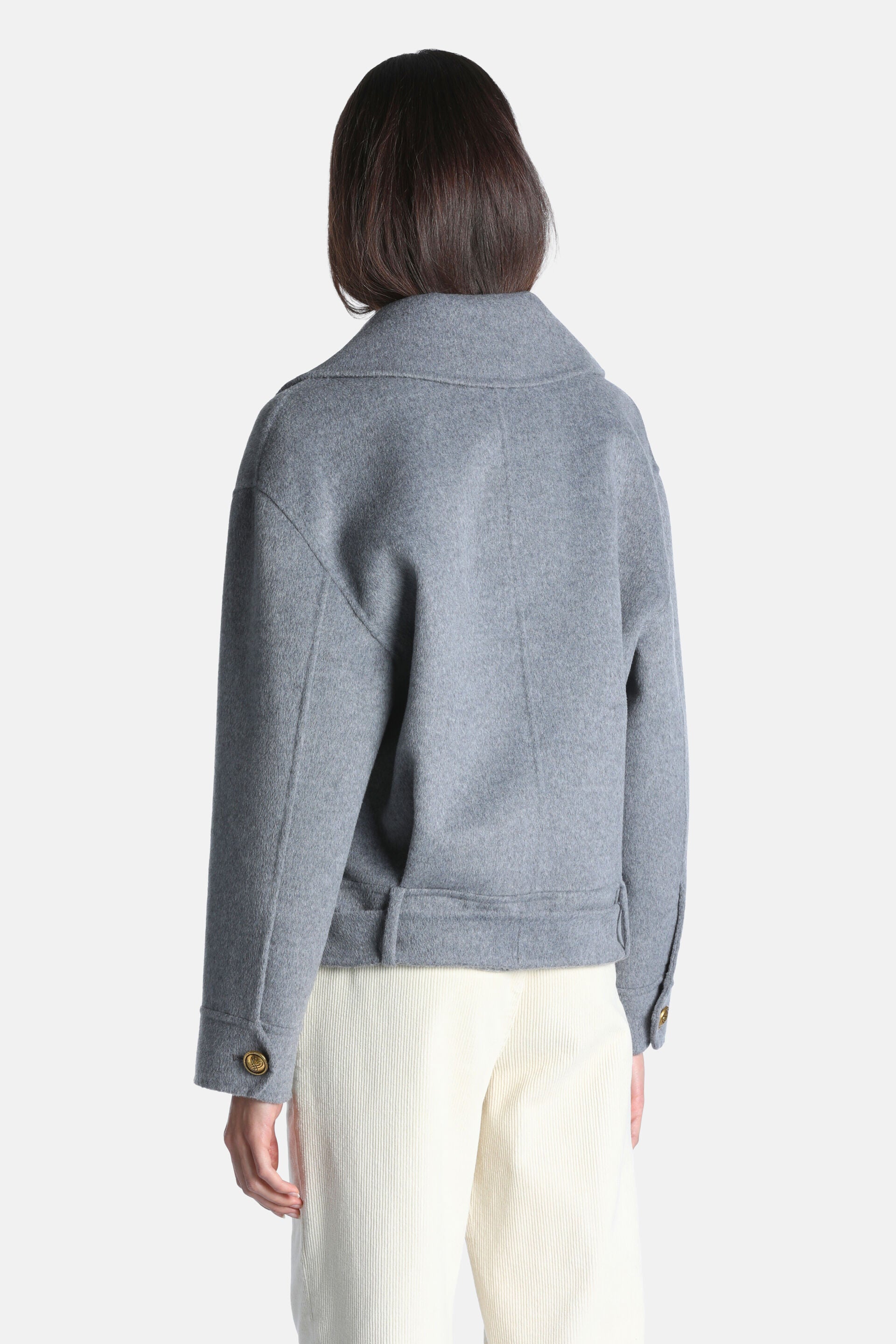 Grey melange cropped jacket with a wide collar, long sleeves, buttoned cuffs with gold-toned buttons, and a half-belt at the