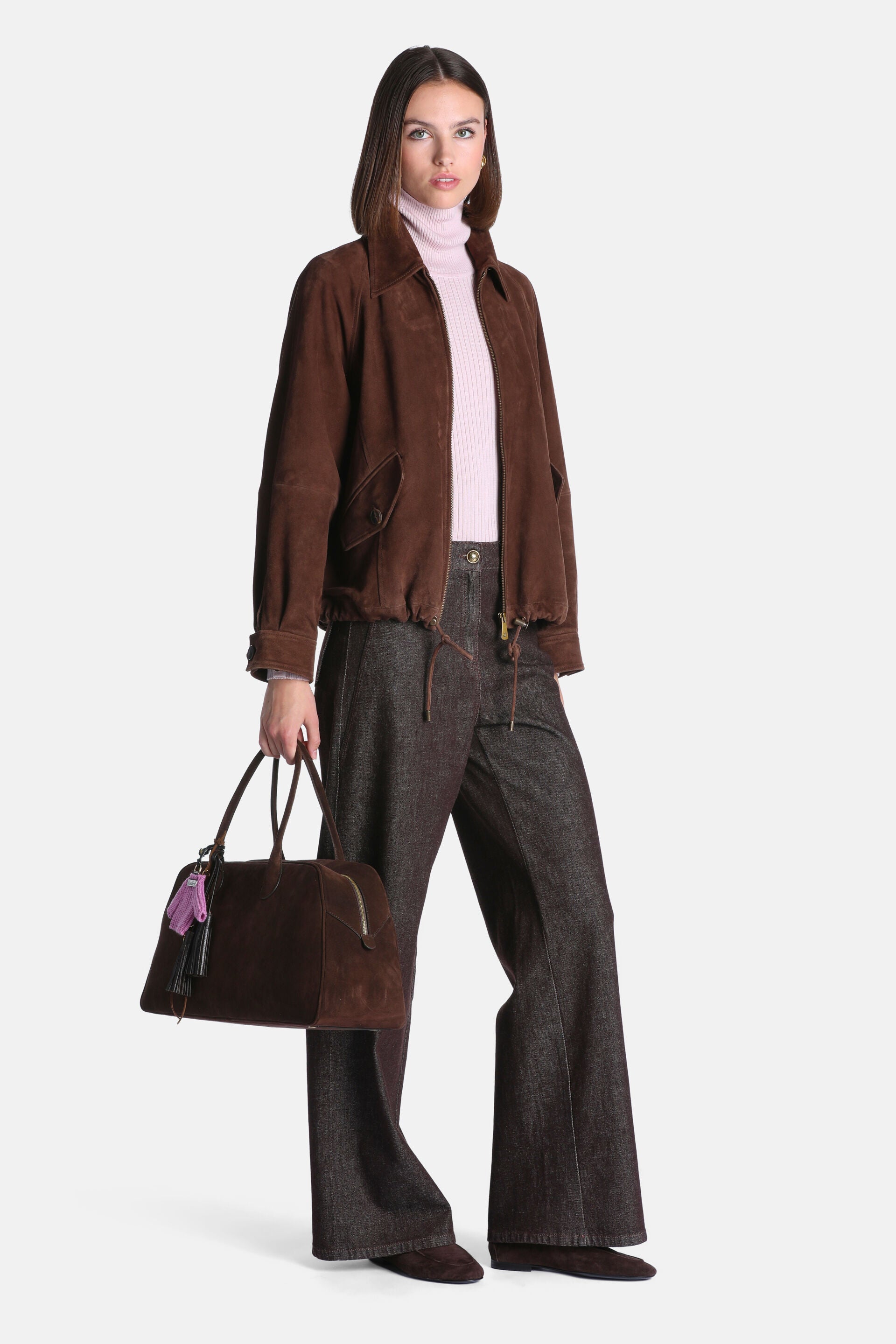Brown suede bomber jacket with a pointed collar, front flap pockets, and a drawstring hem.
