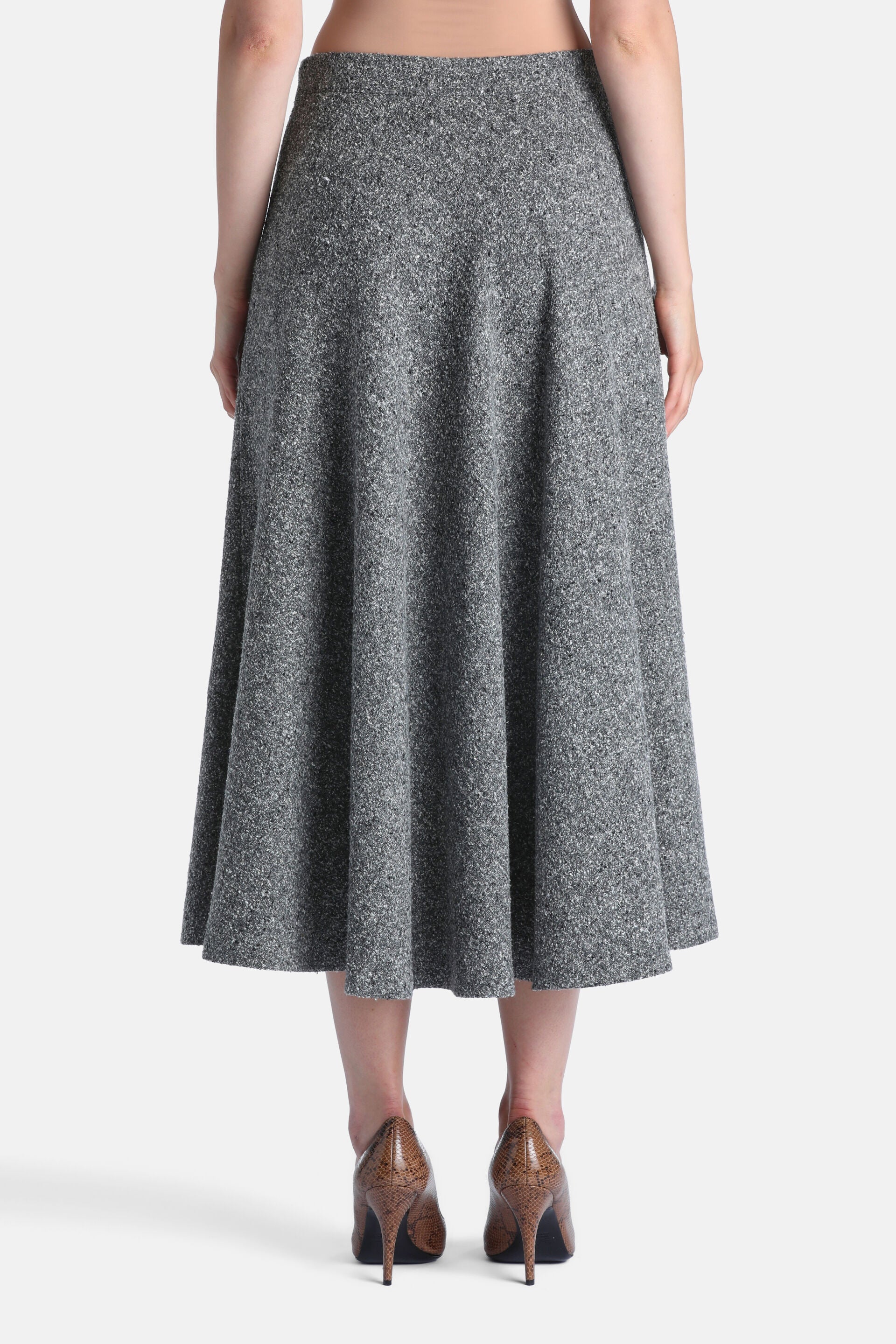 Midi-length A-line skirt in mottled grey-cream tweed with a wide waistband, viewed from the back.