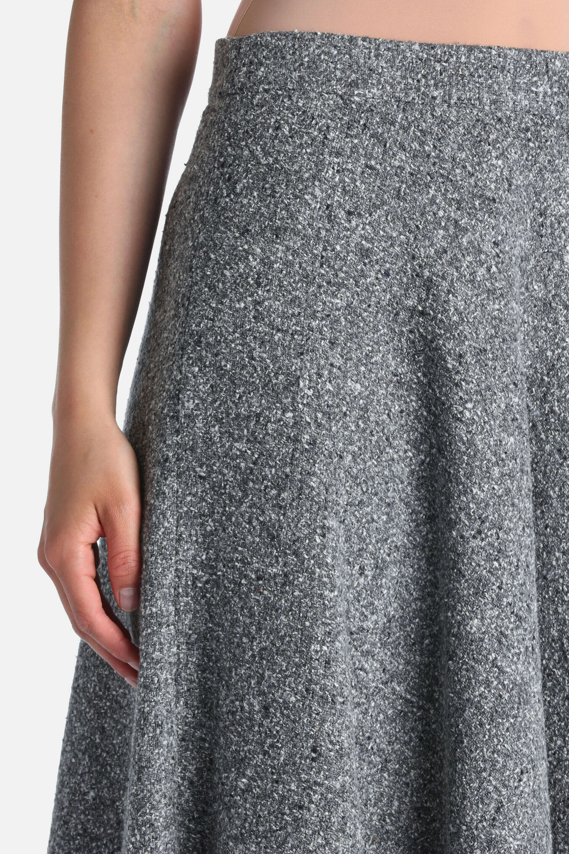 Grey and cream marled knit A-line skirt with a textured, nubbly surface.