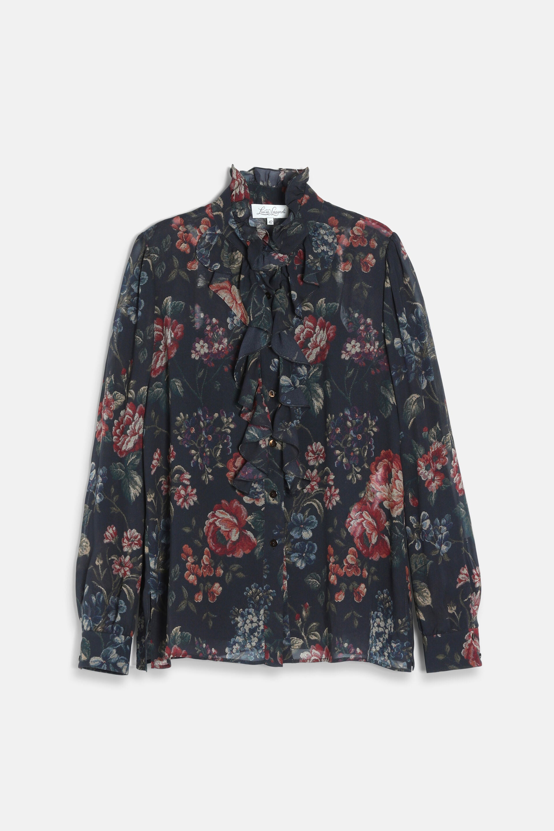 Dark brown floral shirt with a ruffled high neck, ruffled placket, and long sleeves with buttoned cuffs.