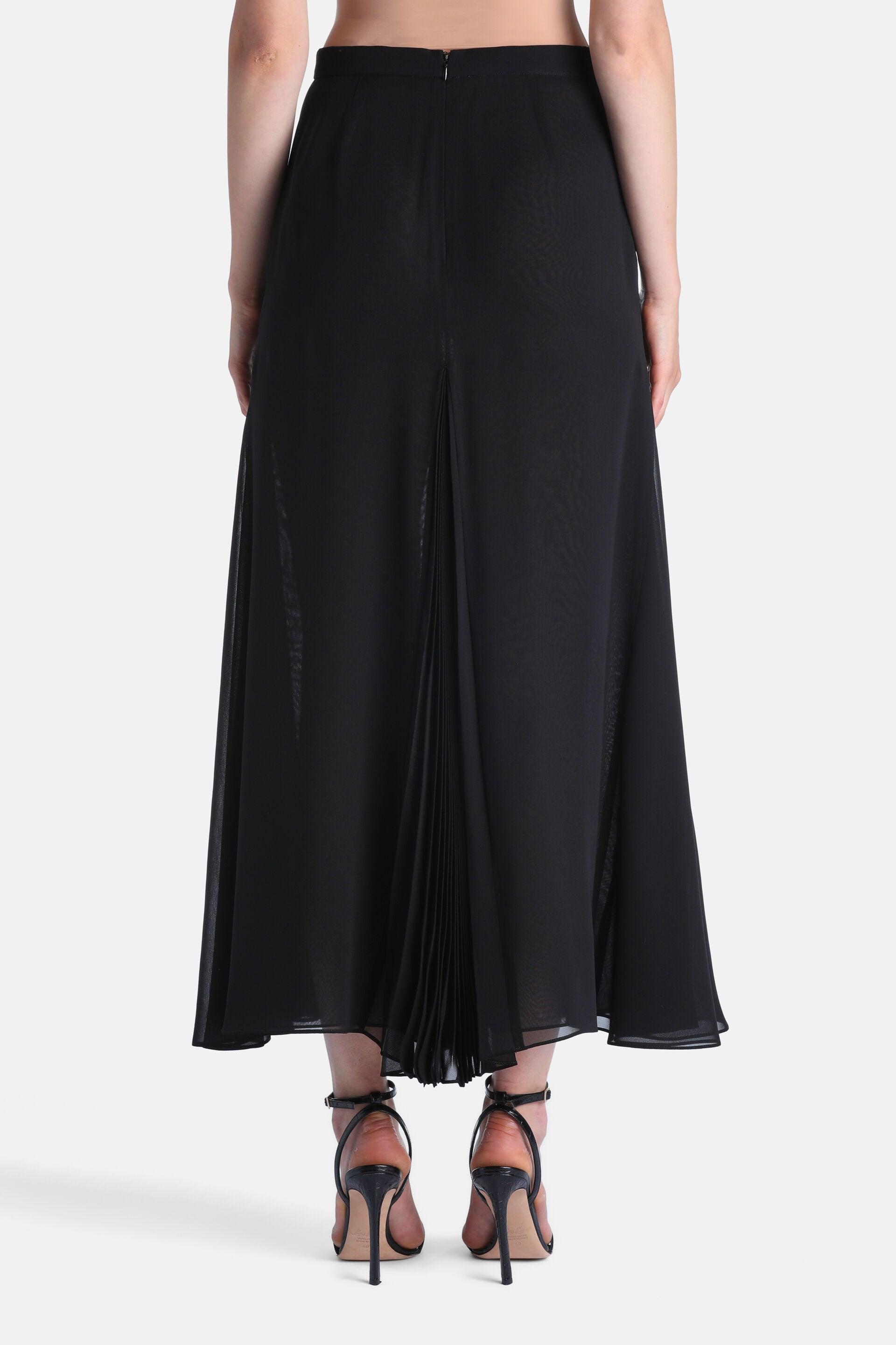 Black sheer maxi skirt with a back zipper and a central vertical pleated panel.
