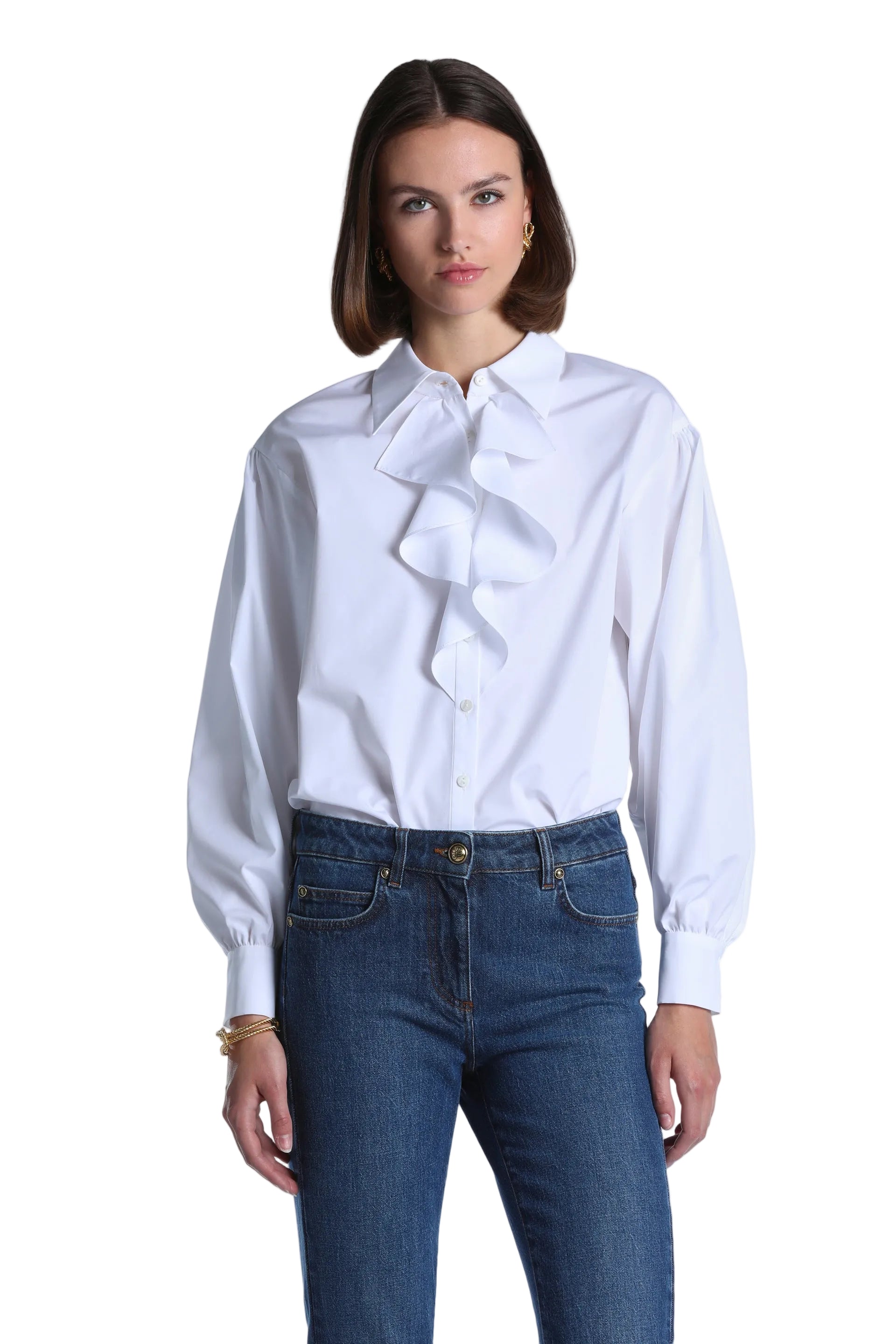 White long-sleeved shirt with a pointed collar, full button placket, and a large cascading ruffle down the front.