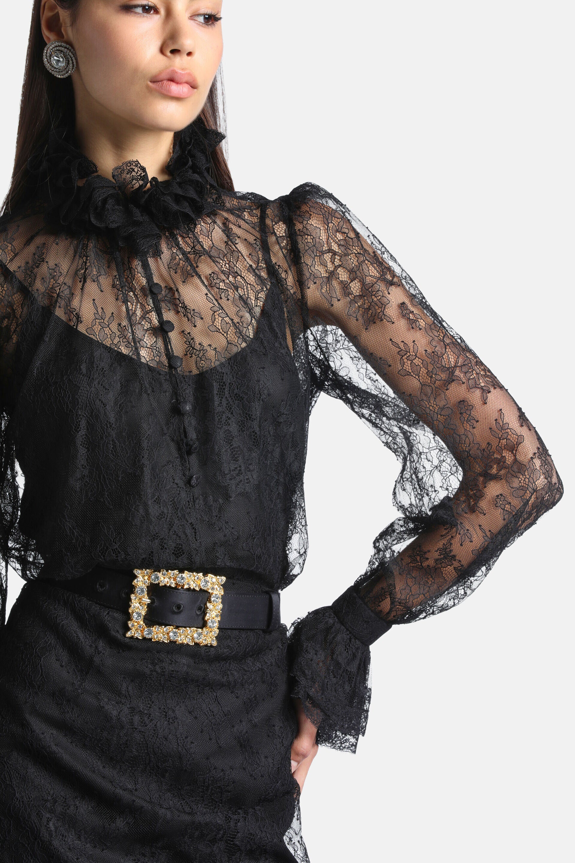 Black sheer lace shirt with a ruffled mock neck, long sleeves, ruffled cuffs, and a front button placket.