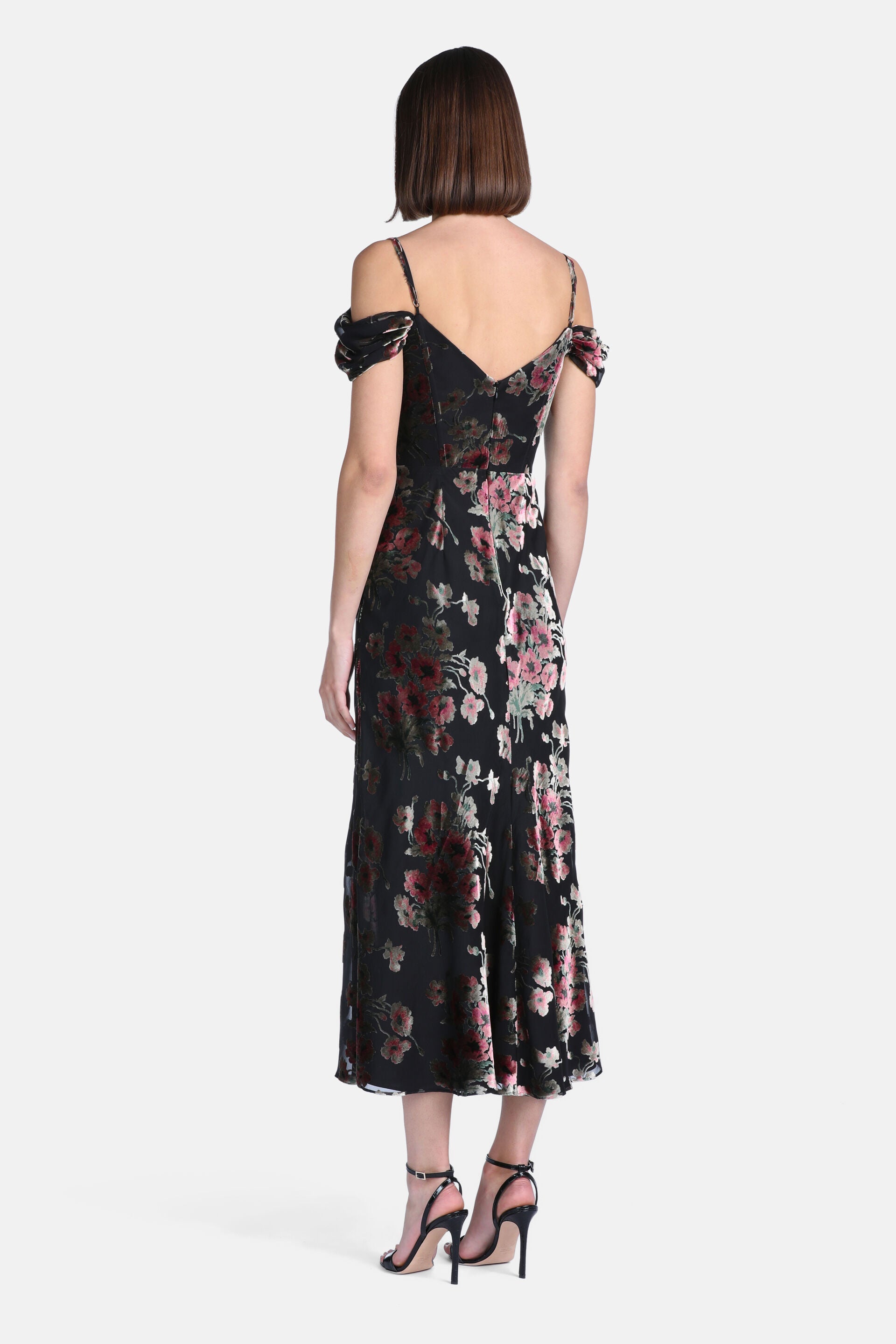Black velvet burnout midi dress with pink and red floral pattern, spaghetti straps, off-shoulder sleeves, and a V-back.